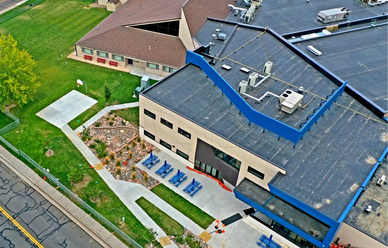 Woodrow Wilson Academy drop-off area with new concrete paving and seating walls